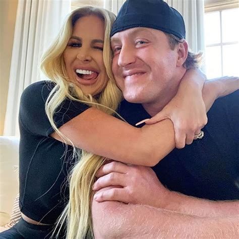 Kim Zolciak wore a see-through strapless bikini top - featuring just a tape-like bit covering her nipples - with matching bottoms. The 38-year-old showed off her flat stomach and almost all of ...